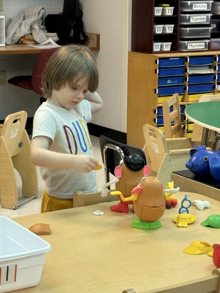 Prek students using gross and fine motor skills