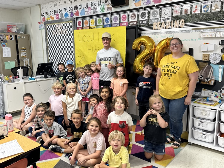 first grade class and football player