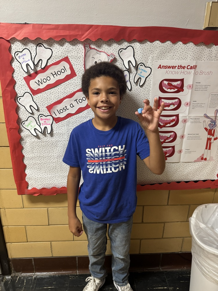 a student with their lost tooth