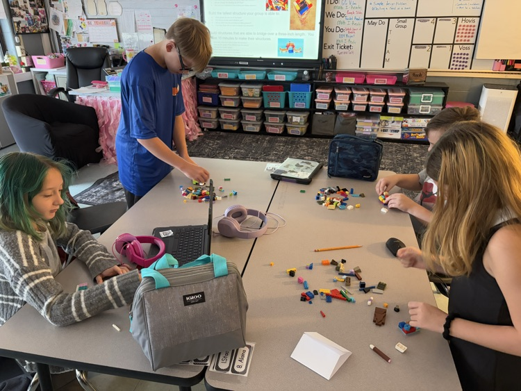 students building with LEGOS 