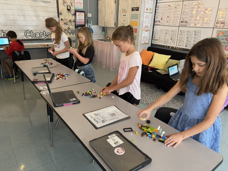 students building with LEGOS 