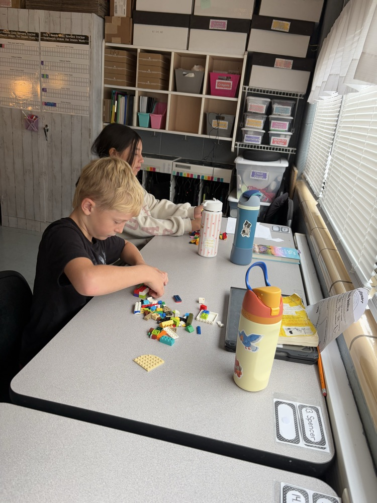 students building with LEGOS 