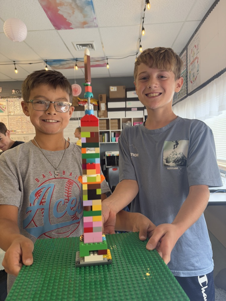 students building with LEGOS 