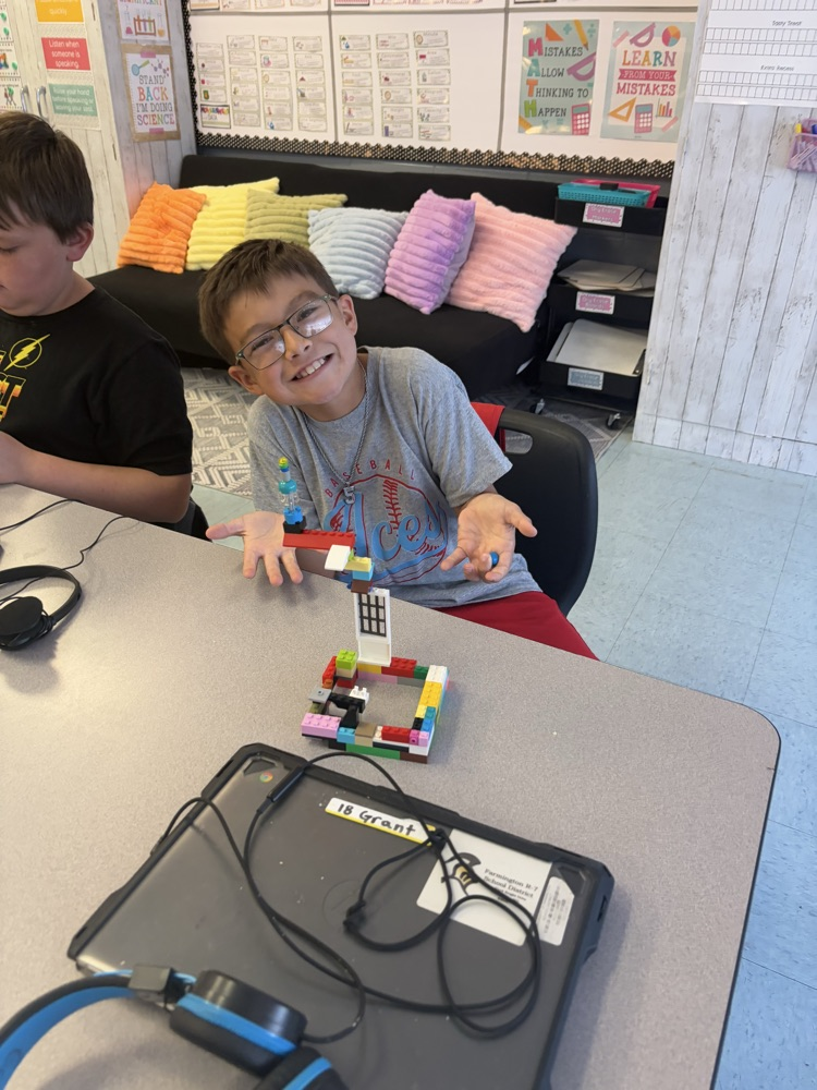 students building with LEGOS 