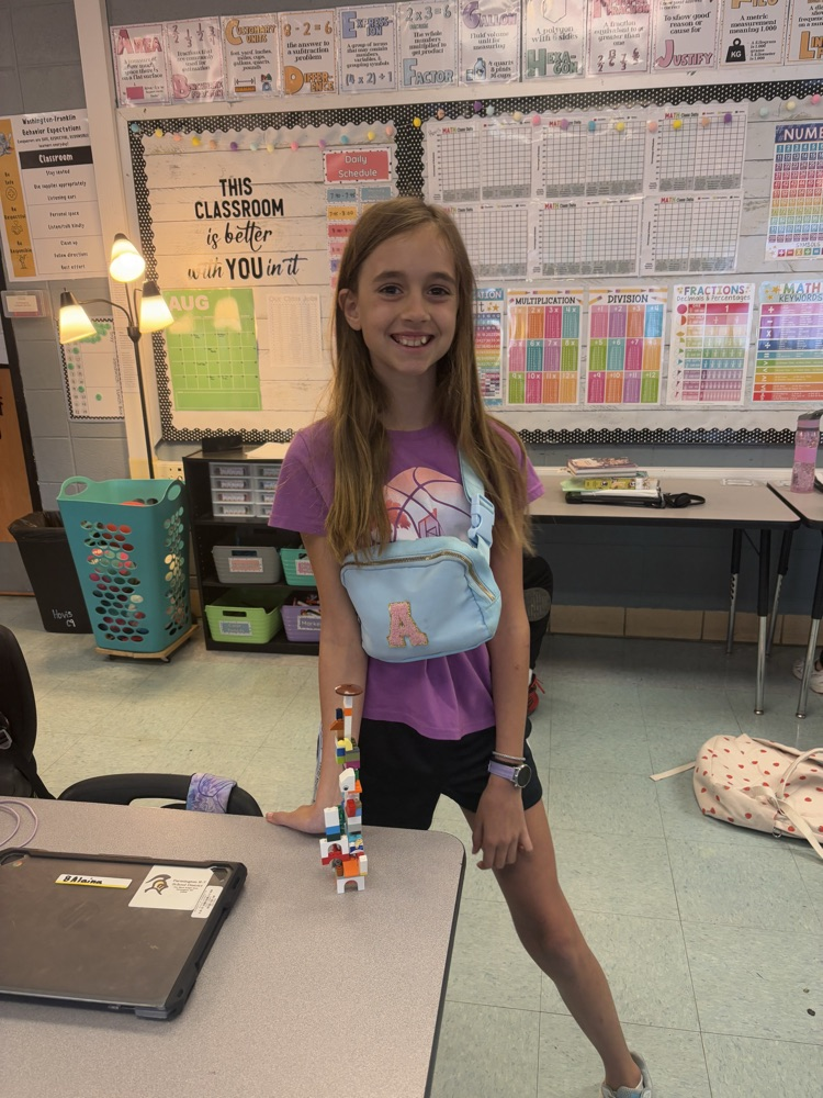 students building with LEGOS 