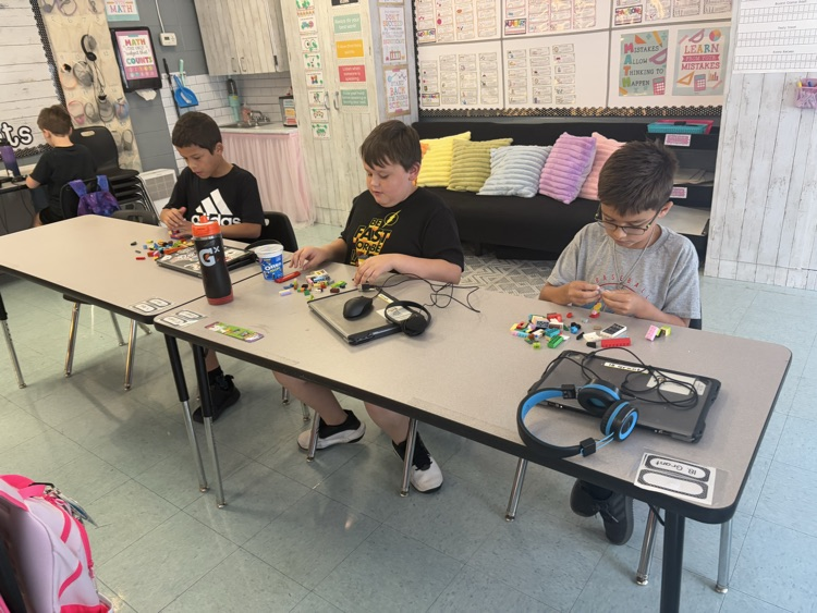 students building with LEGOS 