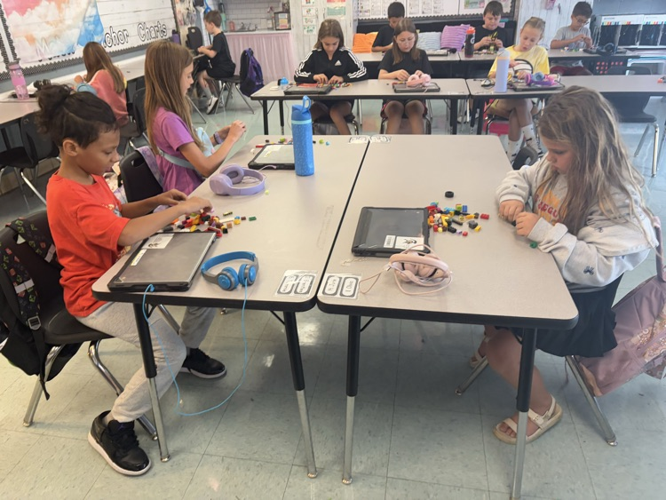 students building with LEGOS 