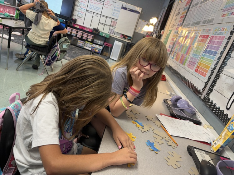 students collaborating on puzzle 
