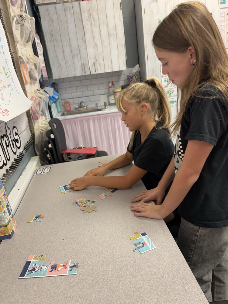 students collaborating on puzzle 