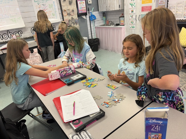 students collaborating on puzzle 