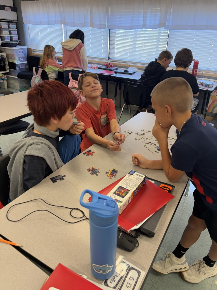 students collaborating on puzzle 