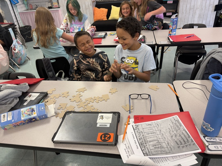 students collaborating on puzzle 