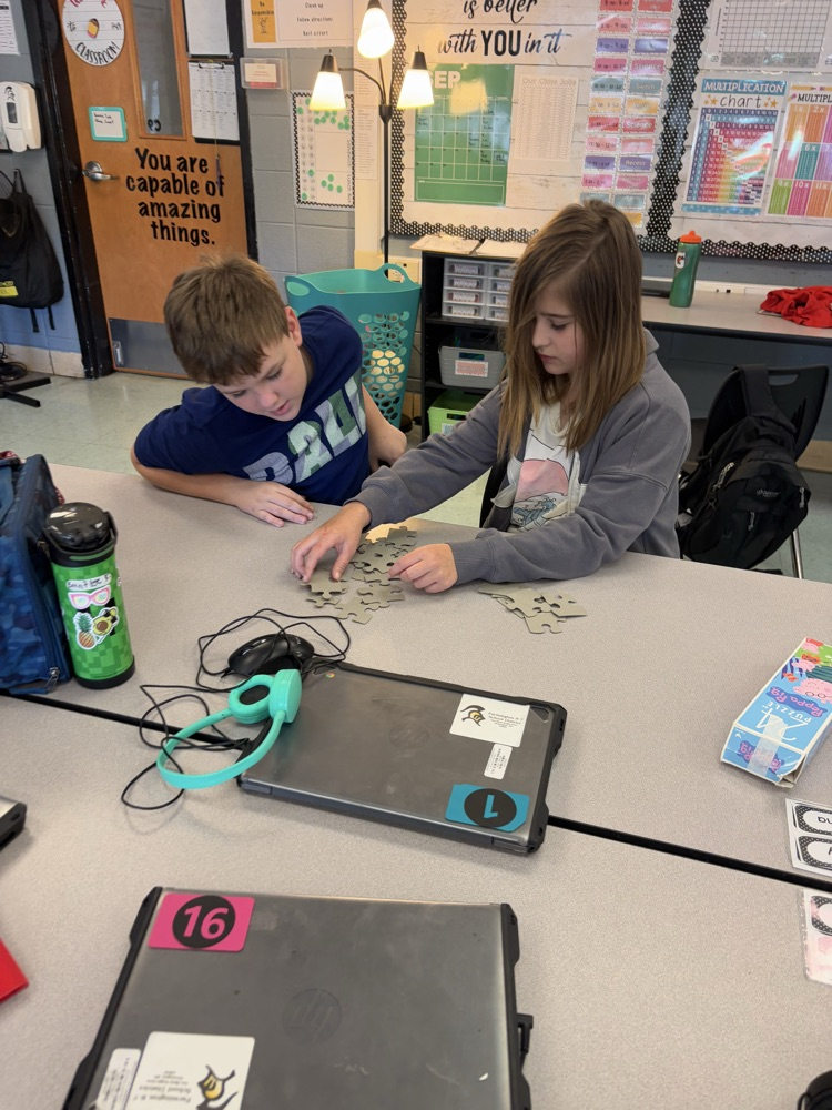 students collaborating on puzzle 