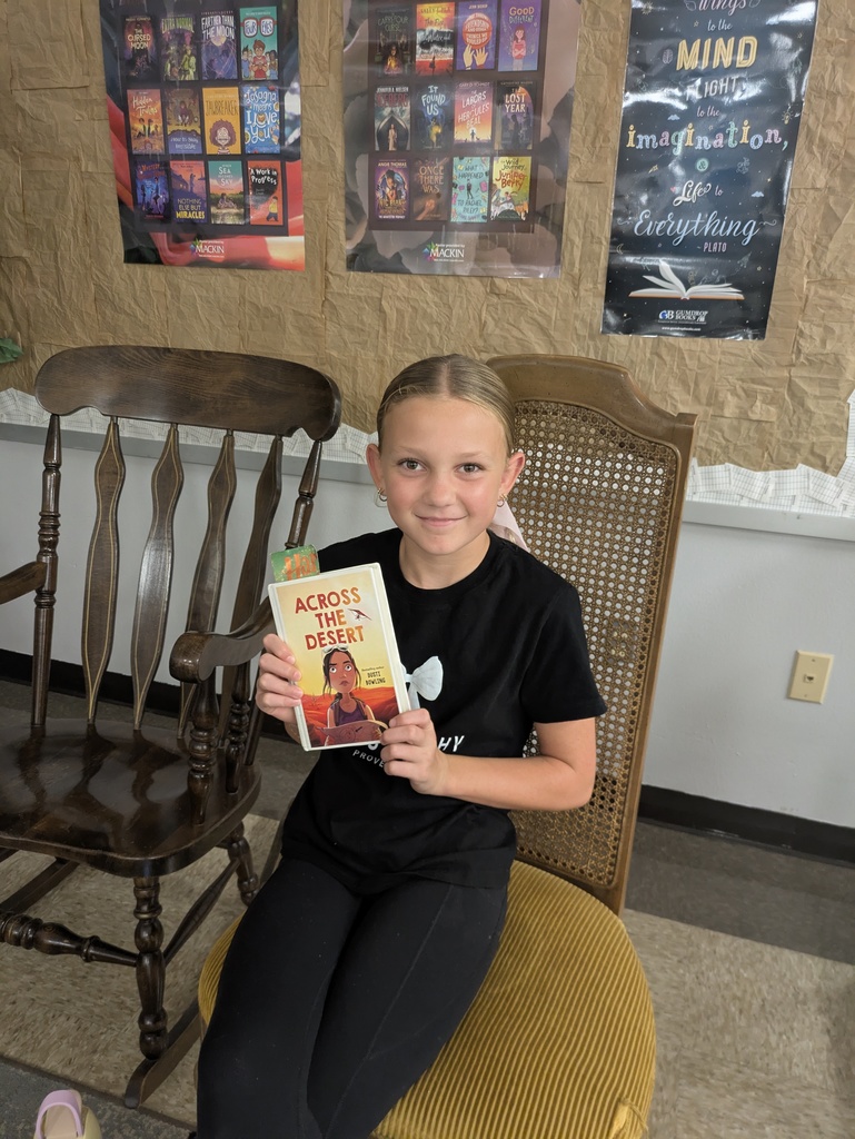 Students sharing the book they are reading.