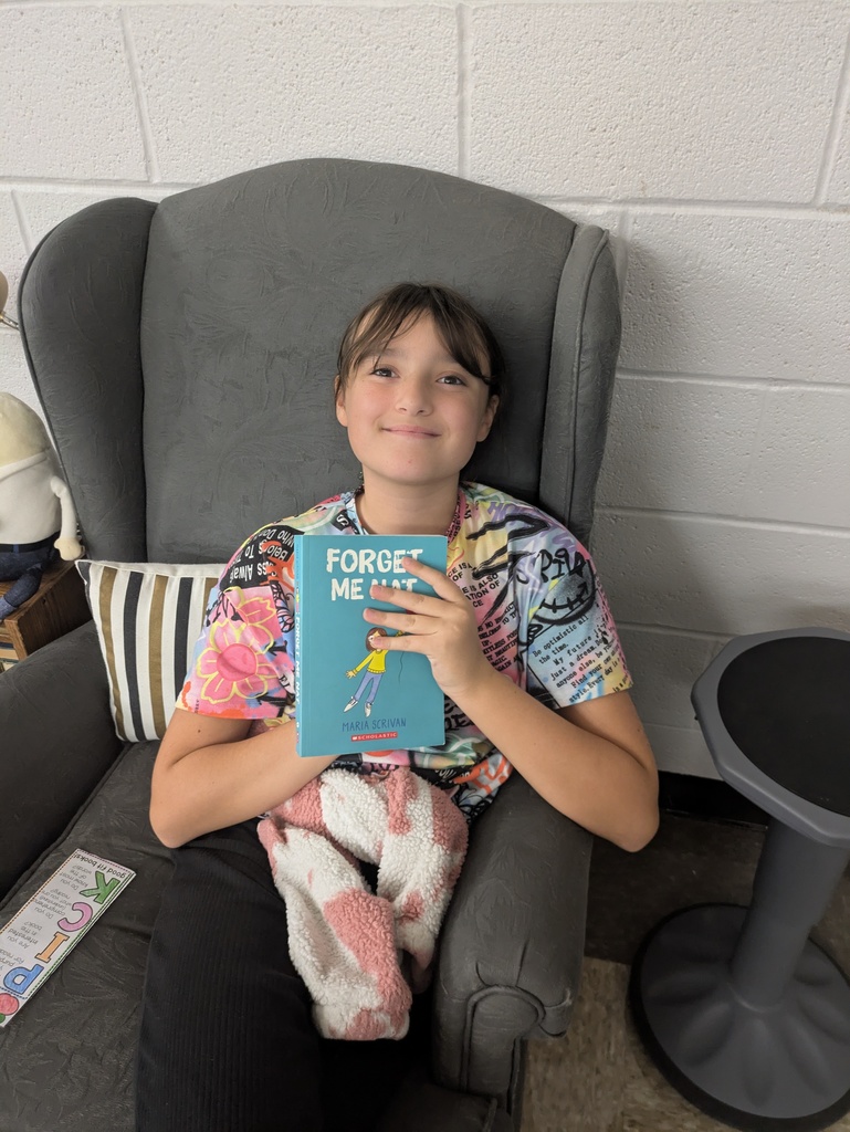 Students sharing the book they are reading.