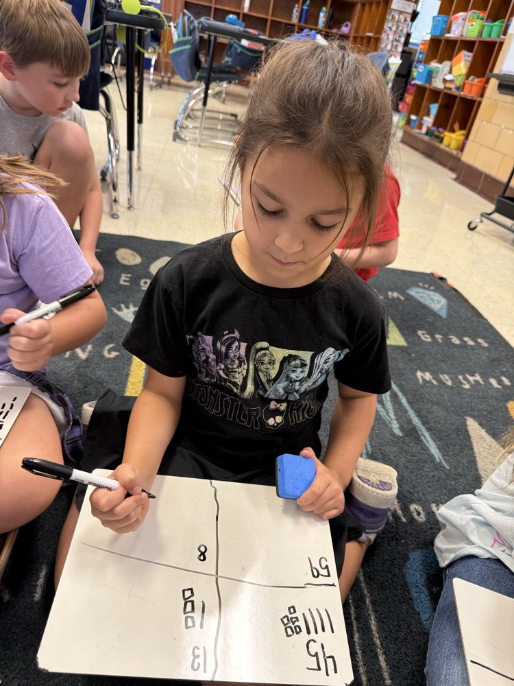 students working on ten and ones in small group math