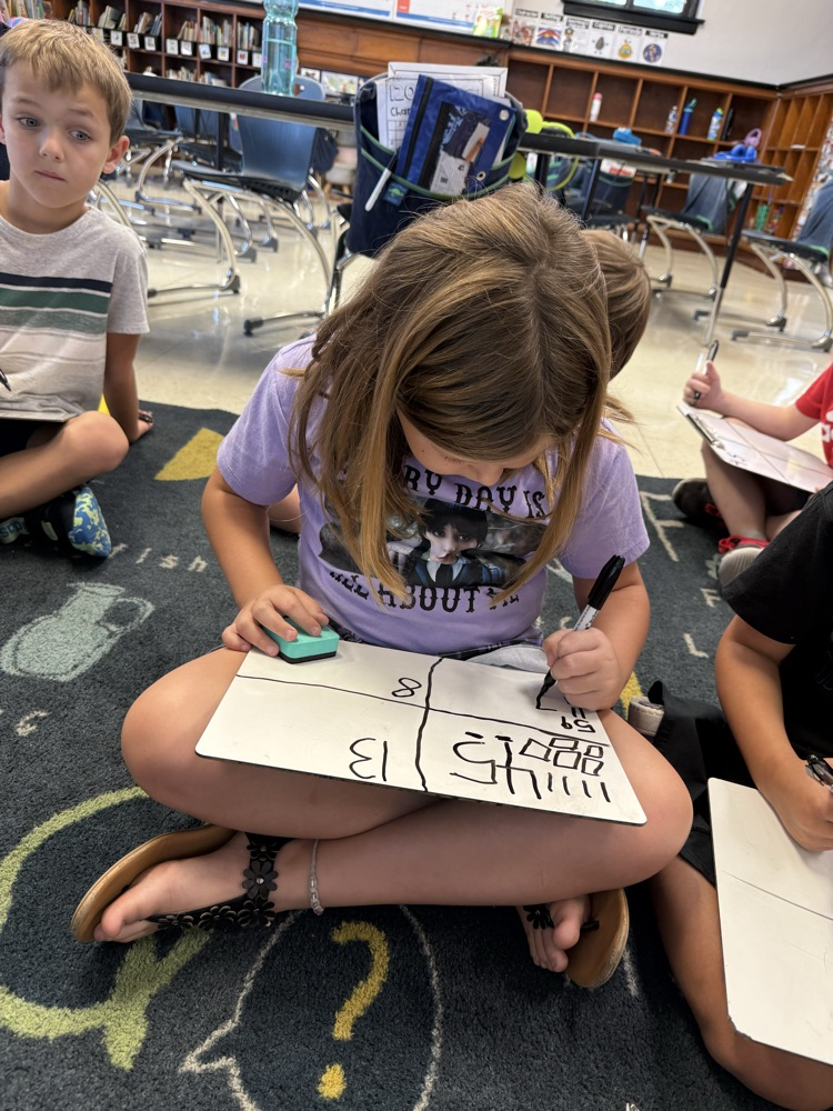 students working on ten and ones in small group math
