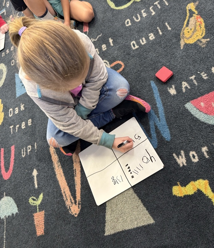 students working on ten and ones in small group math