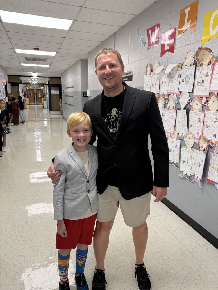 kid and coach dressed alike