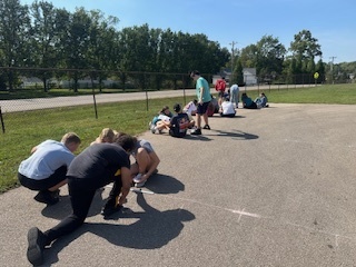 Students completing a solar lab outdoors.