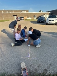Students completing a solar lab outdoors.