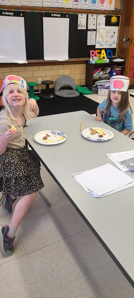 students enjoying an apple snack