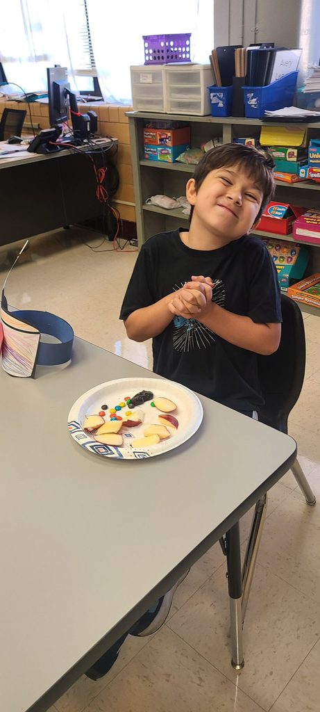 students enjoying an apple snack