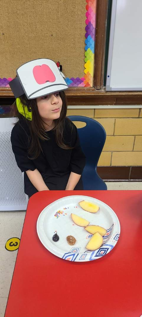 students enjoying an apple snack