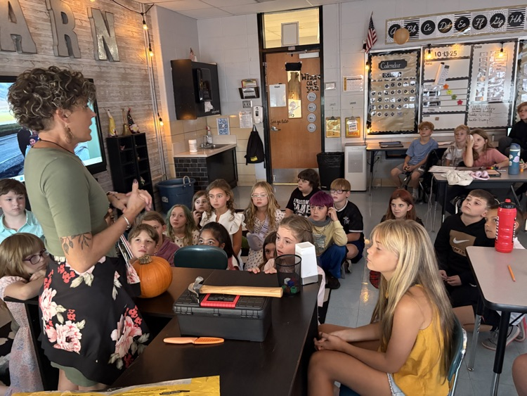 students observing pumpkin