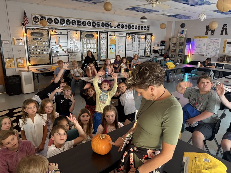 students observing pumpkin
