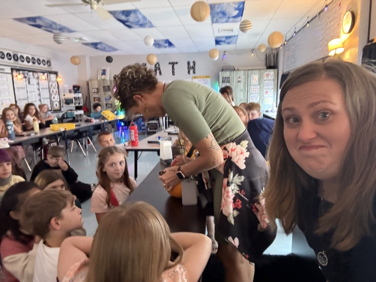 students observing pumpkin