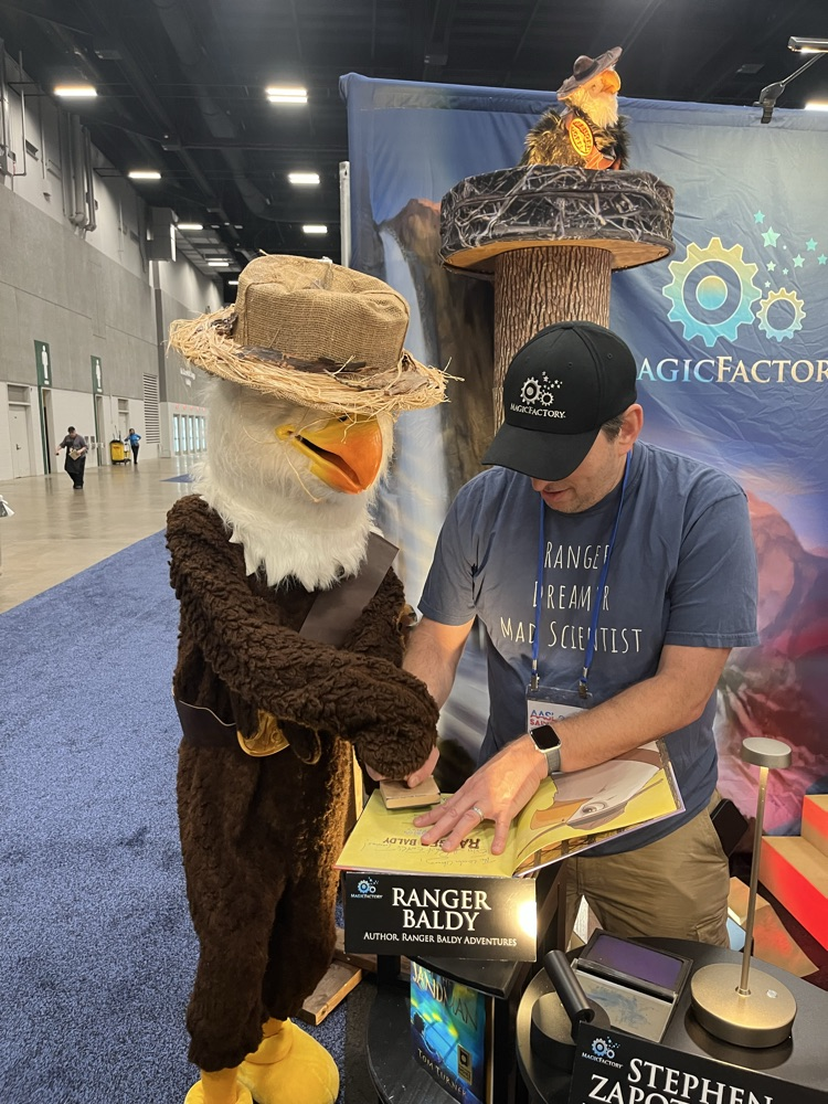Author Ranger Baldy and his Translator signing our copy