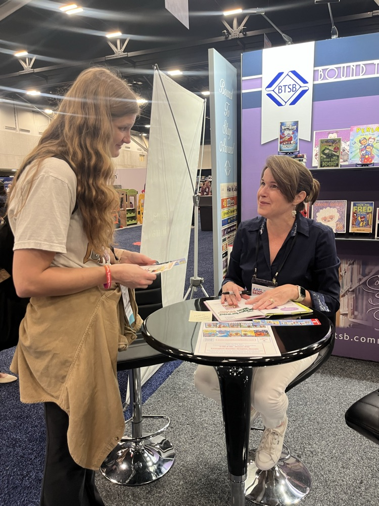 Laura Murray signing a new copy