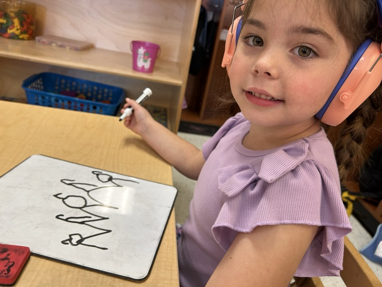 5 little pumpkins sitting on a gate