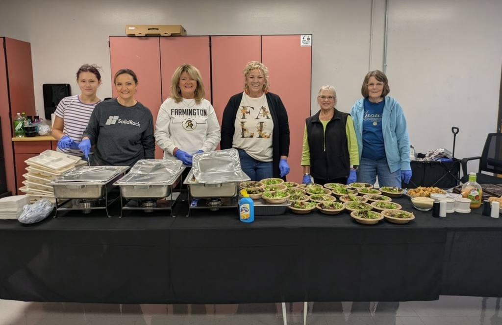 Solid Rock church members serving lunch to staff members during parent-teacher conferences.