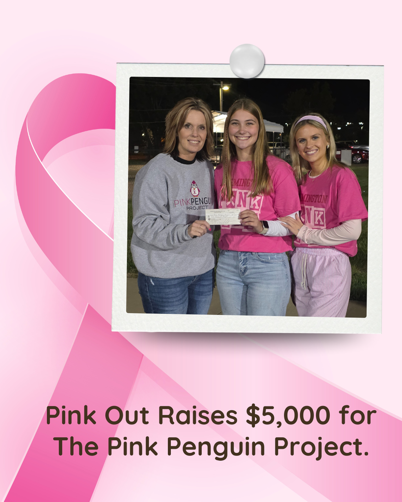 Pink out raises $5,000 for the pink penguin project. Key club members handing check to the representative.
