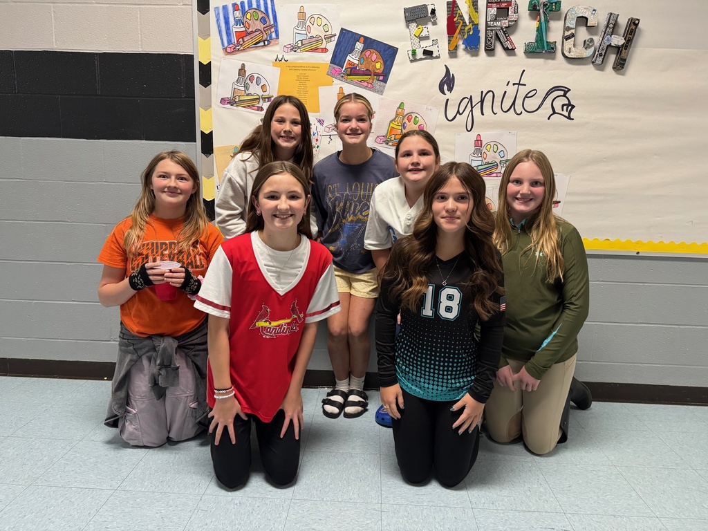 Students showing their coloring contest entries.  