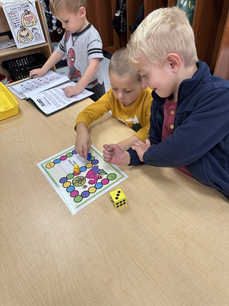 Mrs. G’s students are practicing turn taking and counting with 1:1 correspondence playing board games in their math station🎲