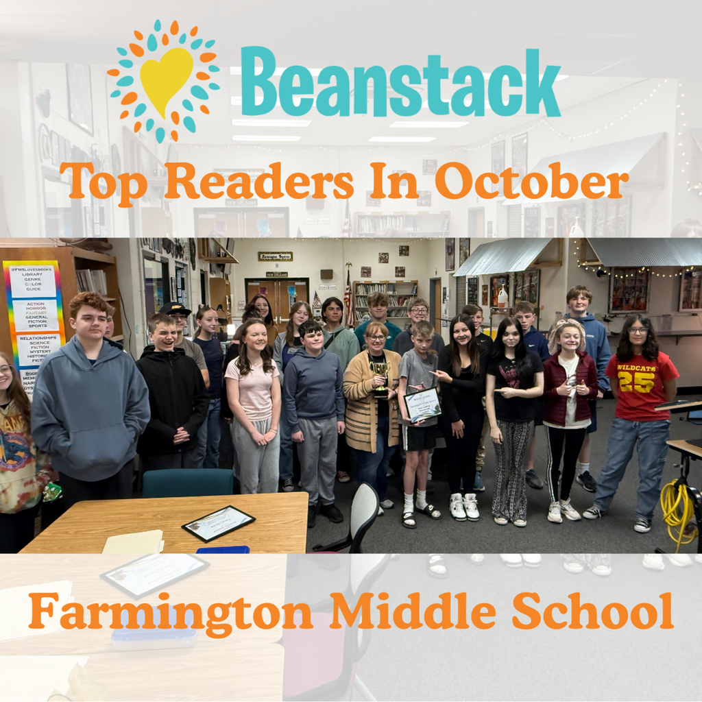 Mrs. Dillon the Library Media Specialist and several middle school students standing in the library with their certificate.