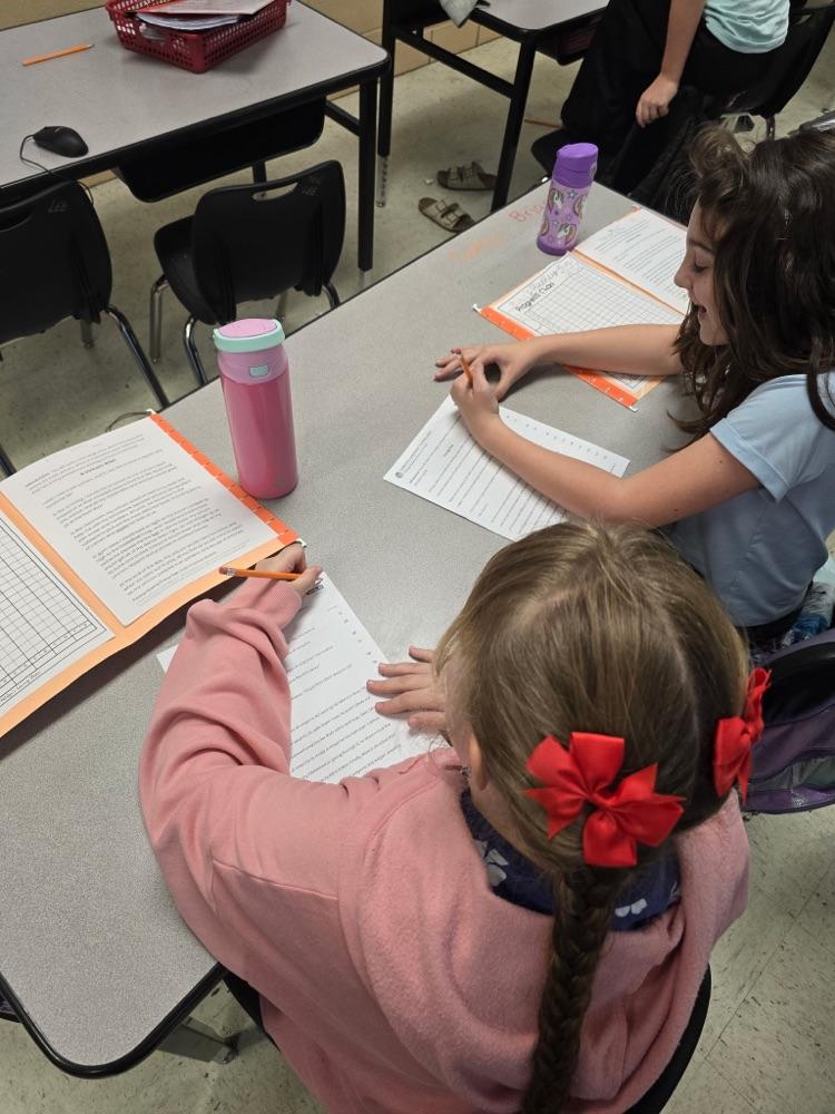 Mr. Lee's class practicing fluency with their partners.