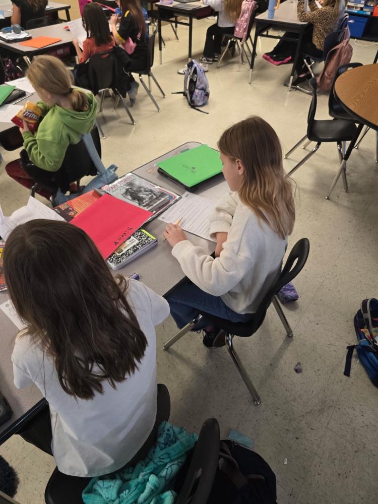 Mr. Lee's class practicing fluency with their partners.
