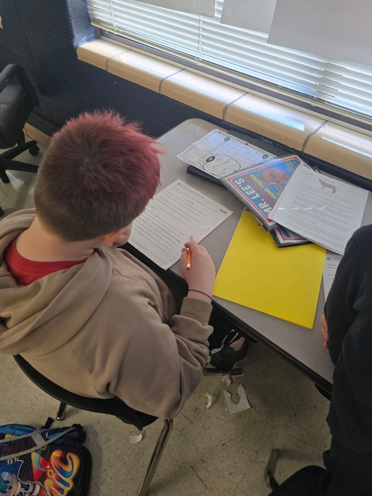 Mr. Lee's class practicing fluency with their partners.