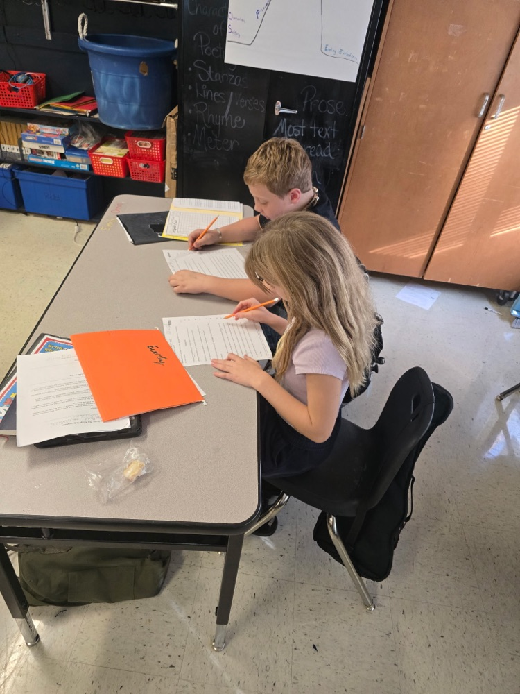 Mr. Lee's class practicing fluency with their partners.