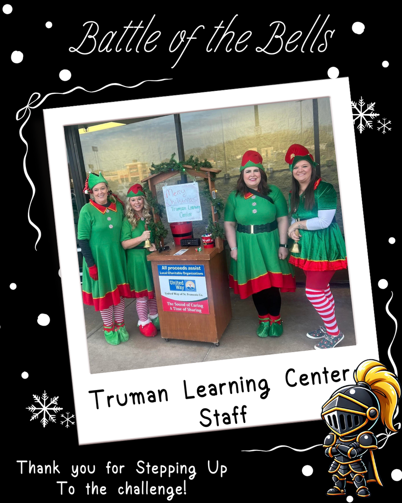 Truman staff members dressed as elves ringing the bell at WalMart.