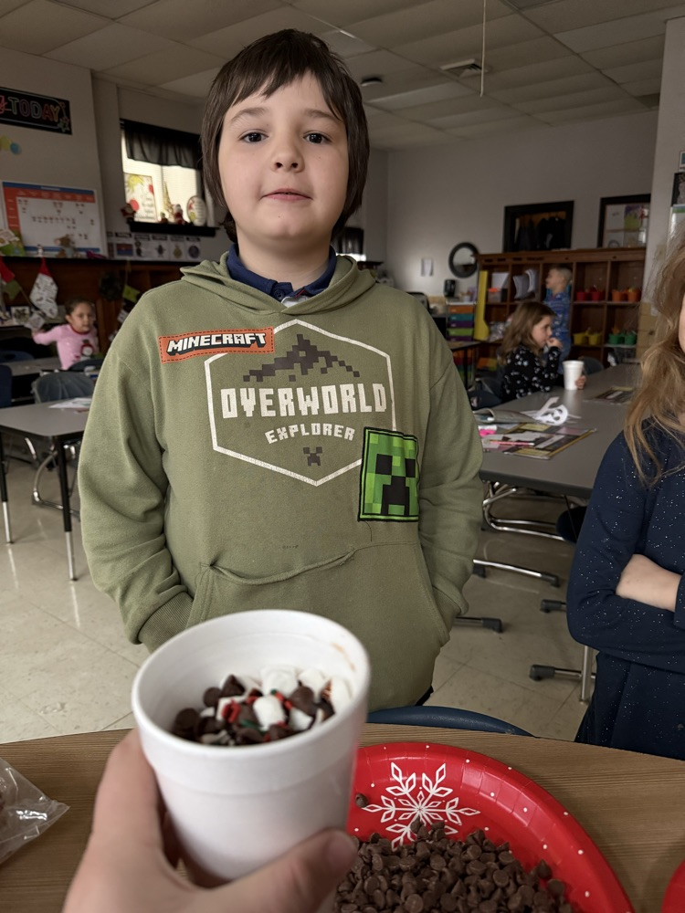 student enjoying hot cocoa