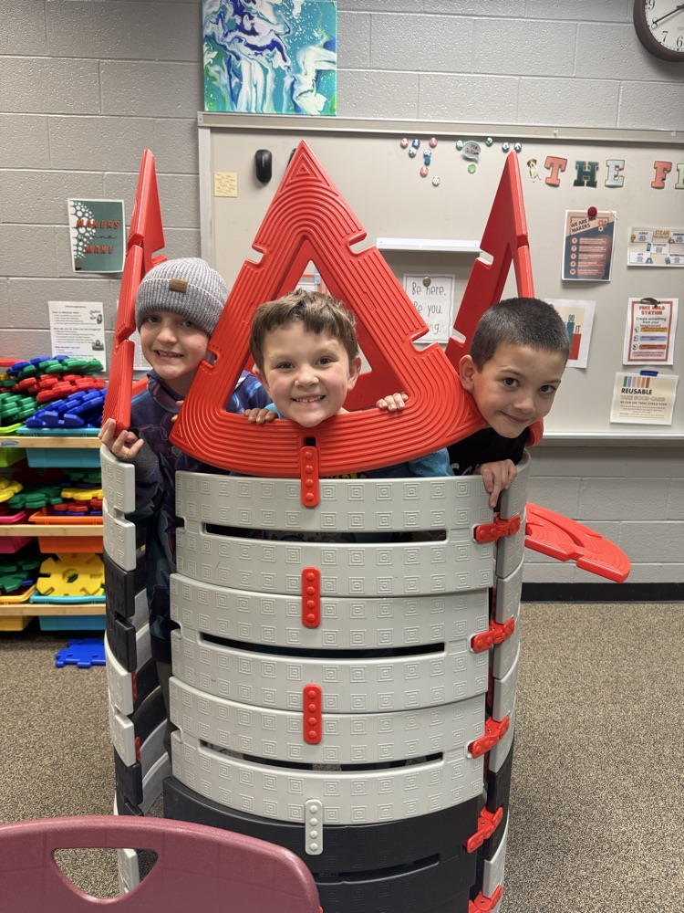 students building with STEM materials