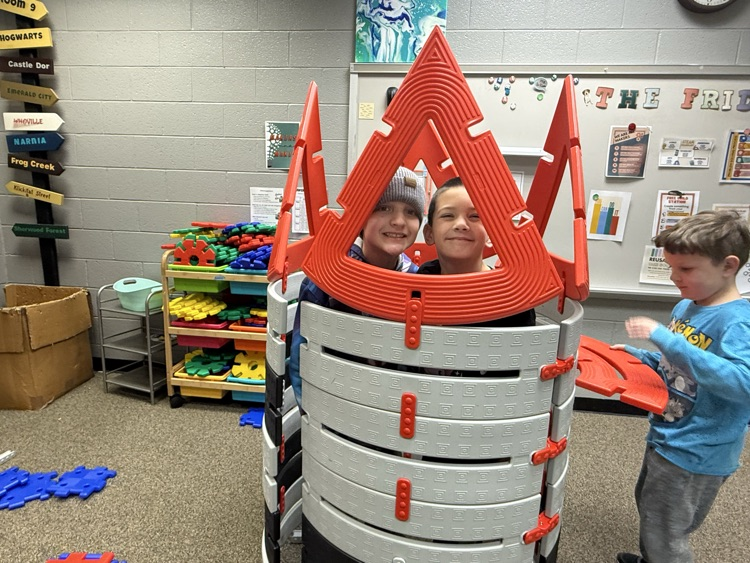 students building with STEM materials