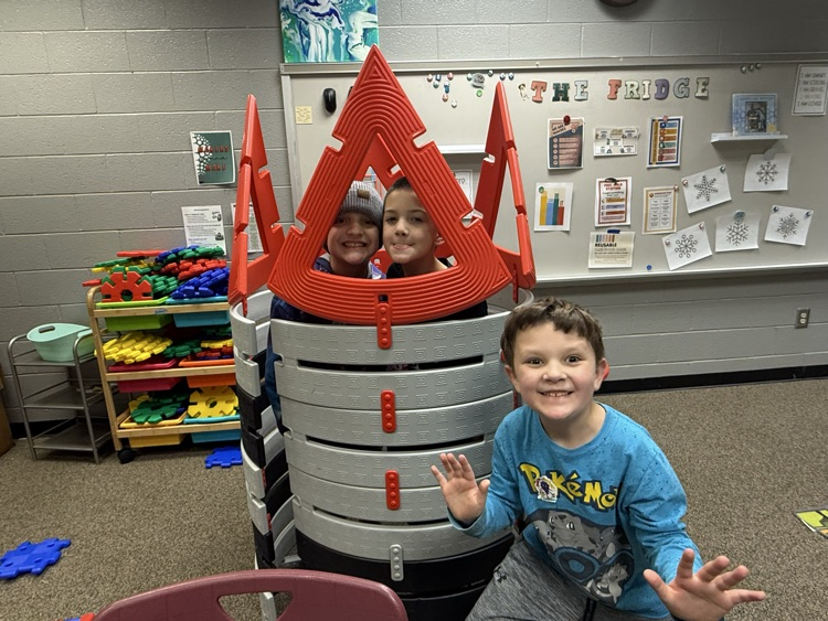 students building with STEM materials
