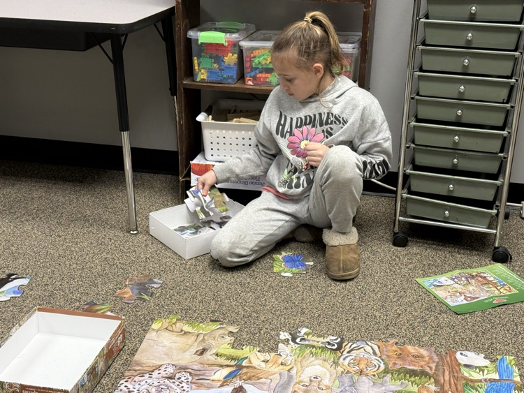 students building with STEM materials