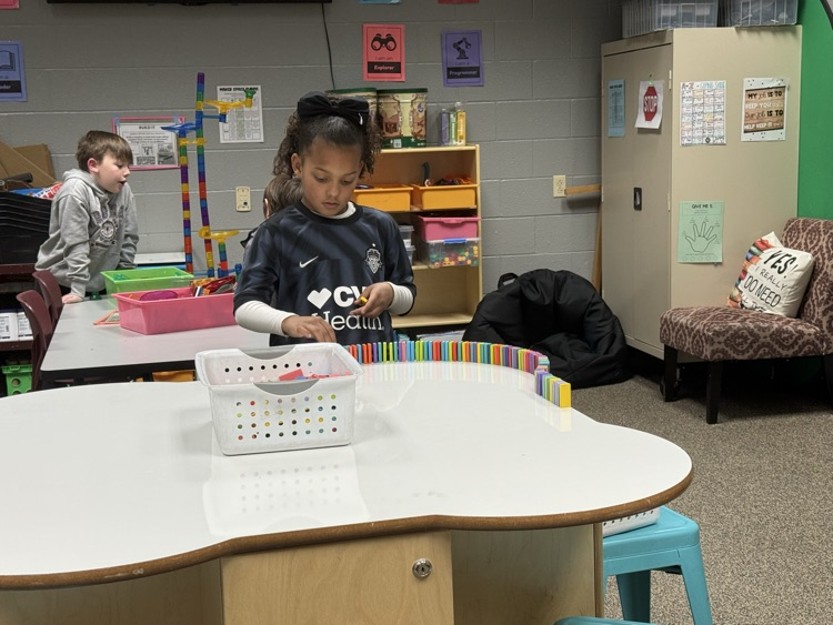 students building with STEM materials